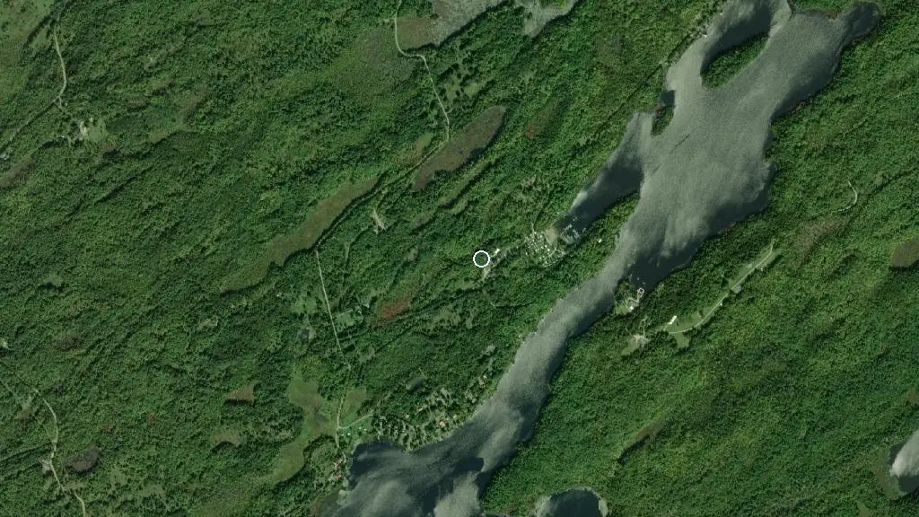 Aerial view of Tiny Village Woodland Park and surroundings