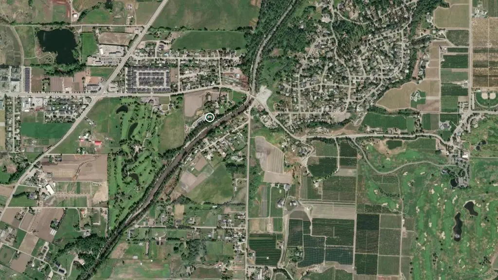 Aerial view of Kelowna Urban Farm and RV Park and surroundings