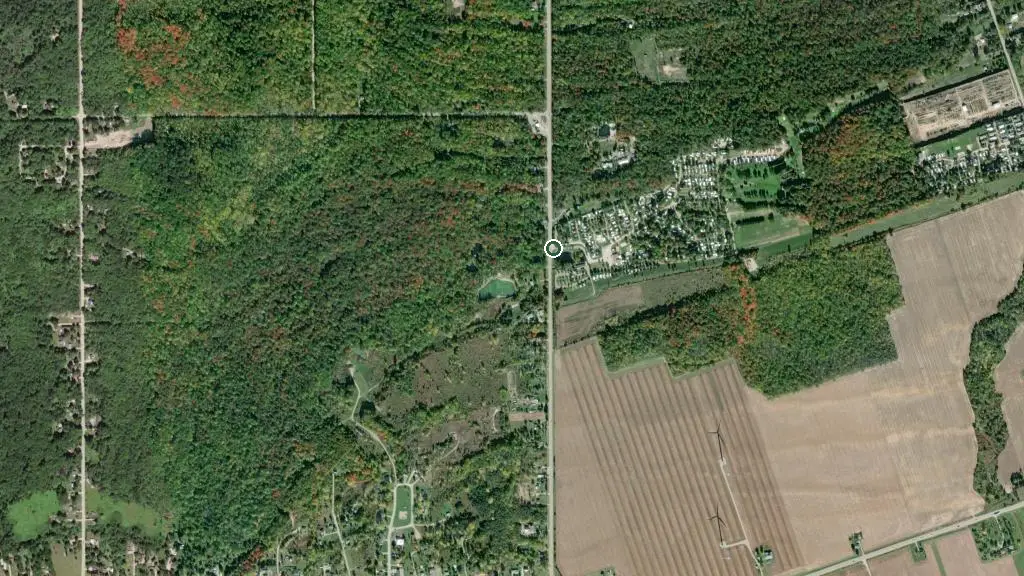 Aerial view of Our Ponderosa Cottage and RV Resort and surroundings