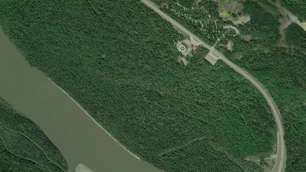 Aerial view of Liard Hot Springs Lodge RV Park and surroundings