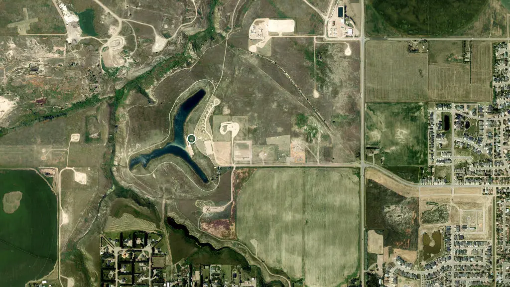 Aerial view of Town of Taber Trout Pond Campground and surroundings